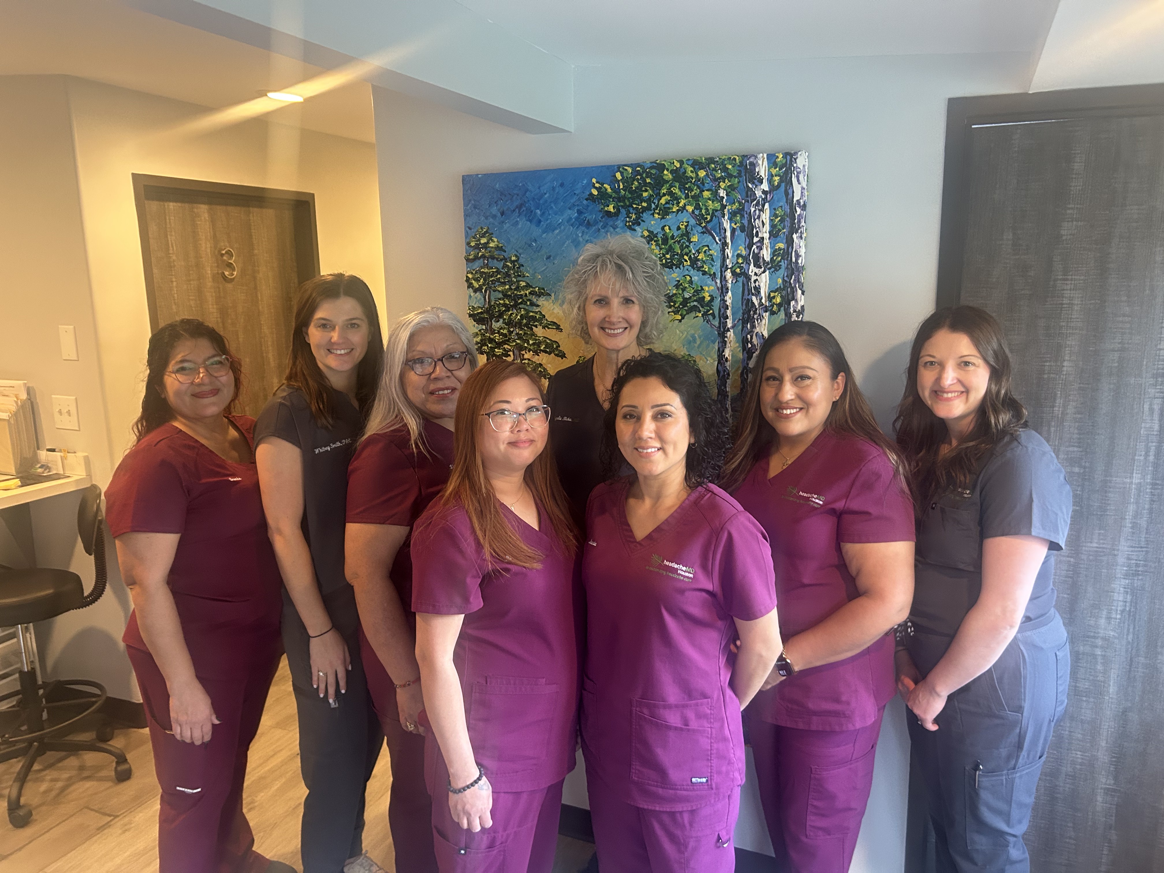 headacheMD® Houston team in front of tree painting